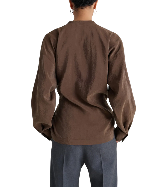 Bluse mit verdrehten Falten