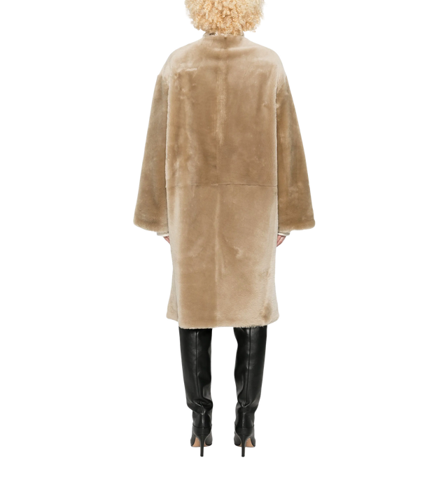 Collarless shearling coat
